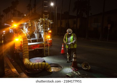 Los Angeles - July 25, 2022: 
Utility Worker Inspects Electrical Vault During Power Outage On Hollywood Boulevard