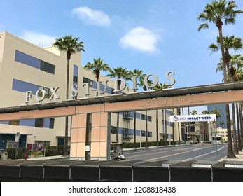 LOS ANGELES, JUNE 5TH, 2018: The Fox Studios logo and sign above the entrance to the 20th Century Fox Studios lot on Pico Boulevard and Motor Avenue in Century City, against a blue sky.