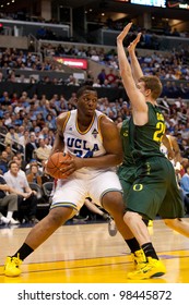 LOS ANGELES - MARCH 10: UCLA Bruins C Joshua Smith #34 & Oregon Ducks F E.J. Singler #25 During The NCAA Pac-10 Tournament Basketball Game On March 10 2011 At Staples Center.