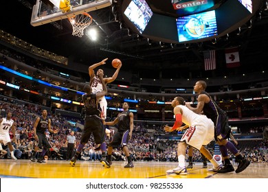 LOS ANGELES - MARCH 12: Arizona Wildcats F Derrick Williams #23 & Washington Huskies F Darnell Gant #44 During The NCAA Pac-10 Tournament Basketball Championship Game Between On March 12 2011 In Los Angeles, CA.