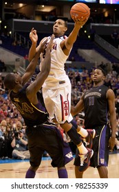 LOS ANGELES - MARCH 12: Arizona Wildcats F Derrick Williams #23 & Washington Huskies F Darnell Gant #44 During The NCAA Pac-10 Tournament Basketball Championship Game Between On March 12 2011 In Los Angeles, CA.