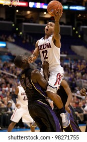 LOS ANGELES - MARCH 12: Arizona Wildcats G Lamont Jones #12 & Washington Huskies Forward Darnell Gant #44 During The NCAA Pac-10 Tournament Championship Game On March 12 2011 At Staples Center.