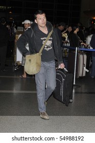 LOS ANGELES - MARCH 12: Australian Actor Sam Worthington Is Seen At LAX. March 12th In Los Angeles, California.