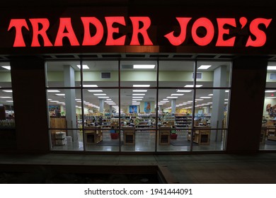 Los Angeles - March 20, 2021:
Trader Joe's Grocery Store Illuminated Sign And View Inside Window Night Exterior