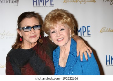 LOS ANGELES - MAY 14:  Carrie Fisher, Debbie Reynolds at the "Debbie Reynolds: The Auction Finale" VIP Reception at Debbie Reynolds Dance Studio on May 14, 2014 in North Hollywood, CA