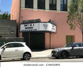 LOS ANGELES, May 26th, 2020: Funny sign on marquee of The Hayworth Theatre on Wilshire Blvd says: "Don't be a Maskhole" in response to mandatory mask wearing ordinance during the coronavirus pandemic.