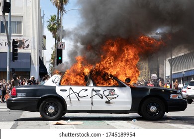 LOS ANGELES - MAY 30, 2020: Police Car Being Burned During Protest March Against Police Violence Over Death Of George Floyd.