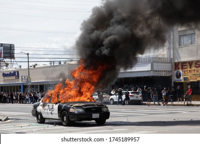 LOS ANGELES - MAY 30, 2020: Police Car Being Burned During Protest March Against Police Violence Over Death Of George Floyd.