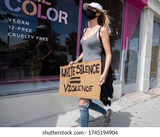 LOS ANGELES - MAY 30, 2020: Unidentified Participant Of Protest March Against Police Violence Over Death Of George Floyd Holding A Sign.