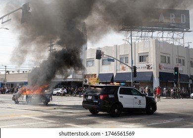 LOS ANGELES - MAY 30, 2020: Police Car Being Burned During Protest March Against Police Violence Over Death Of George Floyd.