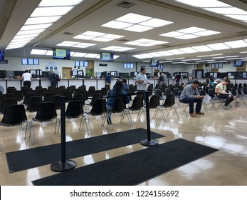 LOS ANGELES, NOV 3rd, 2018: People Are Sitting On Rows Of Chairs While Waiting Inside The DMV Field Office In Culver City, California.