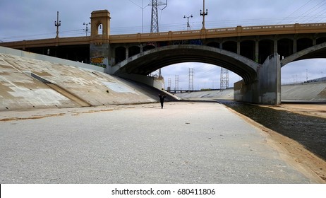 The Los Angeles river with person under the bridge