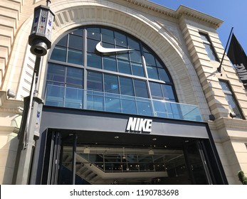 LOS ANGELES, SEP 22, 2018: The Nike sign and logo on the glass facade above the Nike store at the Grove shopping mall at Third and Fairfax in Los Angeles.