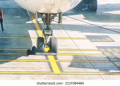 Los Angeles, United States - February 23 2020 : An Airplane Is Parked And Waiting At A Gate And Standing On The Platform With Maintenance Crew Around It