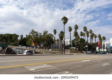 Los Angeles, USA - 11 August 2021: View Of Homeless Tents Set Up Along Streets Los Angeles. Apartment Buildings In The Background