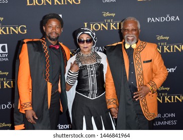 LOS ANGELES, USA. July 10, 2019: Atandwa Kani, Mandi Kani & John Kani at the world premiere of Disney's "The Lion King" at the Dolby Theatre.Picture: Paul Smith/Featureflash
