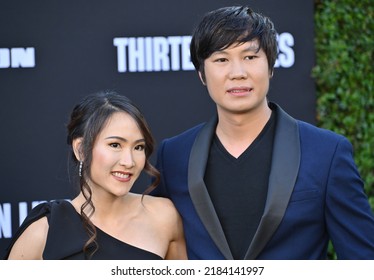 LOS ANGELES, USA. July 28, 2022: Thanet Natisri and Yaha Natisri at the premiere for "Thirteen Lives" at the Regency Village Theatre, Westwood.Picture: Paul Smith-Featureflash