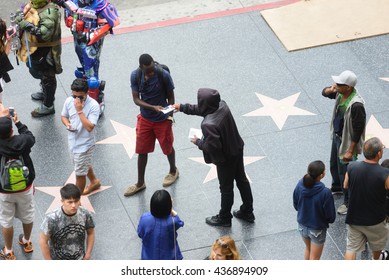 LOS ANGELES, USA - JUNE 11, 2016: Local Artists Selling Their Music On CDs To Tourists And Visitors On Famous Walk Of Fame In Los Angeles, USA. 