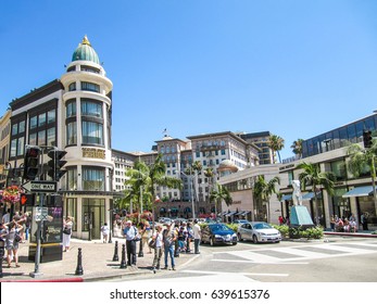 Los Angeles, USA - May 25, 2010: Rodeo Drive With People, Stores And Road With Cars