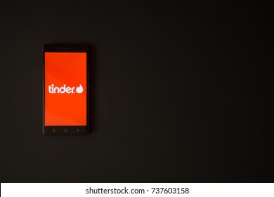 Los Angeles, USA, october 19, 2017: Tinder logo on smartphone screen on black background.