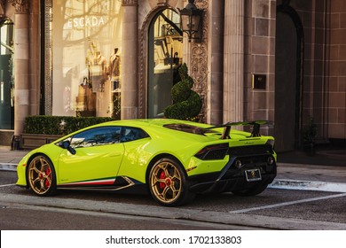 Los Angeles, USA. Year 2017: Green 
Lamborghini Huracan Performante parked at the Four Seasons Beverly Hills hotel. Supercar in Wilshire Blvd. ¨Scada¨Store in the photography.