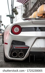 Los Angeles, Year 2016: Rear view close-up of a white Ferrari F12 TDF parked on Wilshire Blvd.