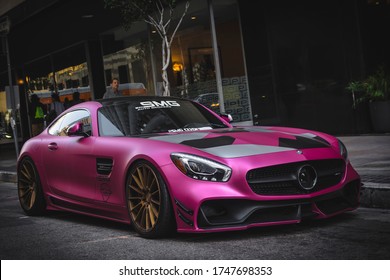 Los Angeles, year 2018: front view of a tuned Mercedes-AMG GTS. Plotted supercar in fuchsia design