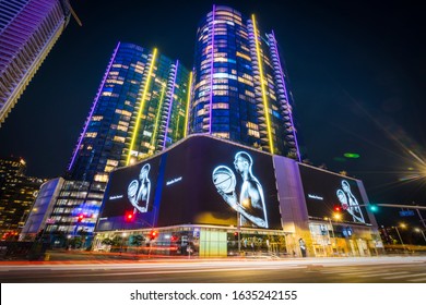 los angeles:02-03-20: "Mamba forever" tribute to Kobe Bryant  on screens displaying at night.