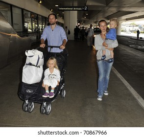 LOS ANGELES-AUGUST 28: Actor Tobey Maguire With Wife And Kids At LAX . August 28, 2010 In Los Angeles, California.