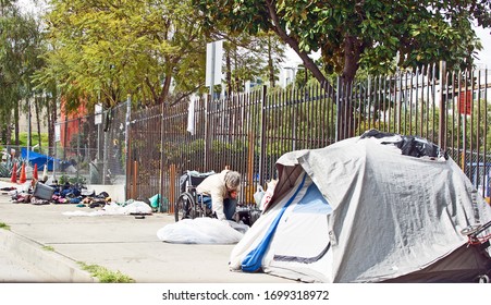 LOS ANGELES/CALIFORNIA - APRIL 8, 2020: Homeless Encampments Along The Roadside Depicting The Growing Epidemic Of Homelessness Amidst The Worldwide Coronavirus Pandemic. Los Angeles, California USA