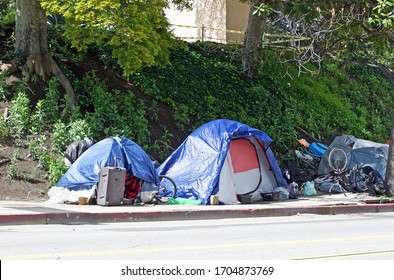 LOS ANGELES/CALIFORNIA -APRIL 8, 2020: Homeless Encampments Along The Roadside Depicting The Growing Epidemic Of Homelessness Amidst The Worldwide Covid-19 Pandemic. Los Angeles,  California USA