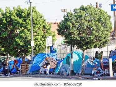 LOS ANGELES/CALIFORNIA - MARCH 25, 2018: Homeless encampment along the roadside depicting the growing epidemic of homelessness in the City of Los Angeles. Los Angeles, California USA