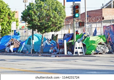 LOS ANGELES/CALIFORNIA - MARCH 25, 2018: Homeless encampment along the roadside depicting the growing epidemic of homelessness in the City of Los Angeles. Los Angeles, California USA