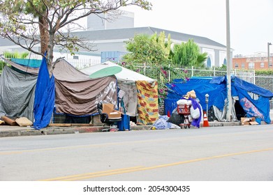 LOS ANGELESCALIFORNIA - OCT. 6, 2021: Homeless Encampment Along The Roadside Depicting The Growing Epidemic Of Homelessness  Amidst Covid-19 Pandemic. Los Angeles, California USA