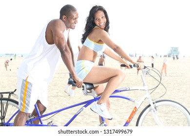 Los Angeles,CA/USA  April 25,2009 : A Couple Enjoying A Day At The Beach Riding A Tandem Bike.