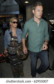 LOS ANGELES-FEBRUARY 14: Actress SInger Jessica Simpson Is Seen With Boyfriend Eric Johnson At LAX. February 14th, 2010 In Los Angeles, California