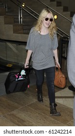 LOS ANGELES-JULY 11: Actress Dakota Fanning Is Seen At LAX. July 11, 2010 In Los Angeles, California