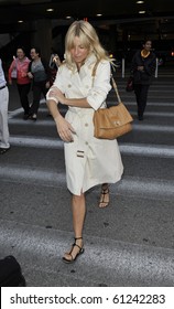 LOS ANGELES-JULY 4: Actress Sienna Miller Is Seen At LAX . July 4, 2010 In Los Angeles, California