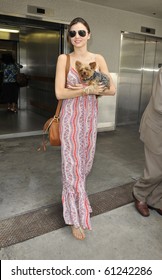 LOS ANGELES-JUNE 14: Model Miranda Kerr Is Seen With Her Dog At LAX. June 4, 2010 In Los Angeles, California