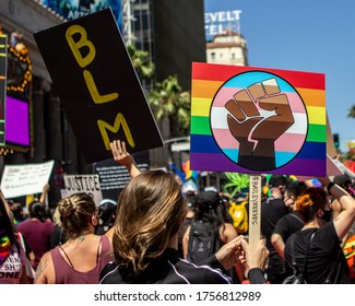 Los Angles, CA / USA - June 14, 2020:  Protesters Hold BLM And A Rainbow Fist Sign At The All Black Lives Matter March In Hollywood