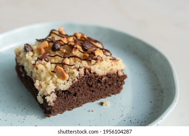 Lose Up Of Delicious Chocolate Crumble Cake  On Light Blue Ceramic Tray 