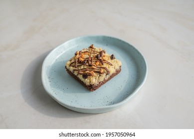 Lose Up Of Delicious Chocolate Crumble Cake  On Light Blue Ceramic Tray 