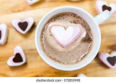 Lose Up Of Hearts And Hot Chocolate Viewed From Above On A Wooden Table. Sweet Treat For Valentines Day.