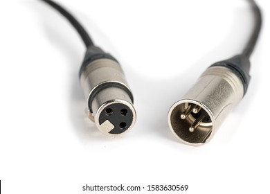 lose up macro view of a male and a female XLR audio cable connectors isolated on white
