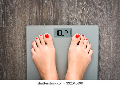 Lose weight concept with person on a scale measuring kilograms - Shutterstock ID 332045699