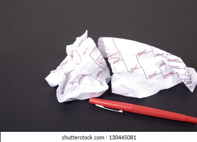 A Losing March Madness Basketball Tournament Bracket Torn With Red Markings.