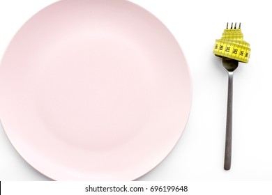 Losing Weight. Strict Diet. Empty Plate And Measuring Tape On Fork Instead Food On White Background Top View Mockup