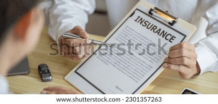 Loss Adjuster Insurance Agent Inspecting Damaged Car. Sales manager giving advice application form document considering mortgage loan offer for car  insurance.