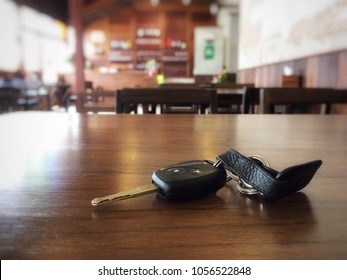 Loss Car Key On Brown Wood Table In Restaurant