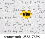 Lost and found concept. To find or reveal something hidden or missing. The word found written on the missing piece of a jigsaw puzzle.